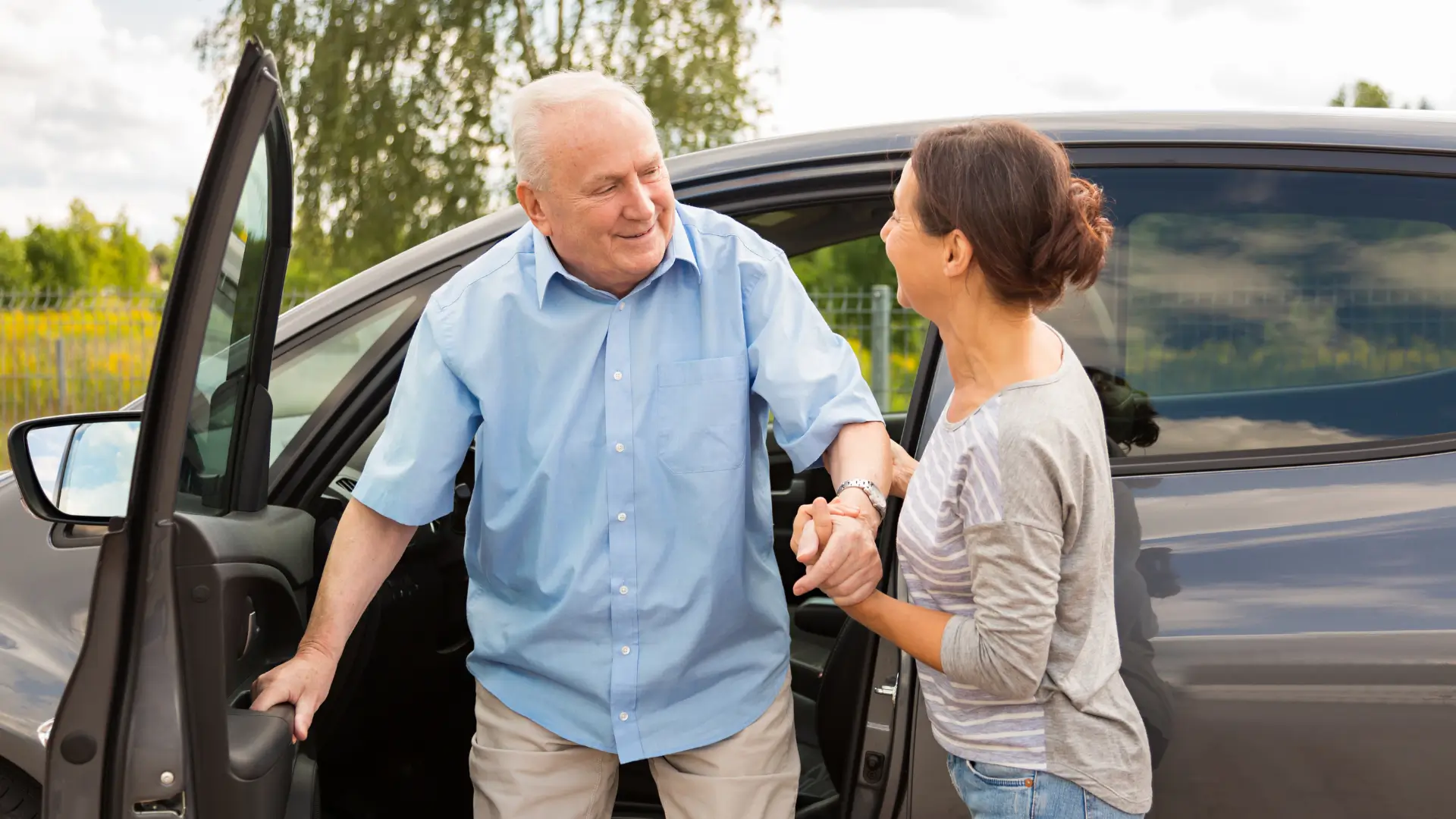 Senior driving with assistance from a caregiver