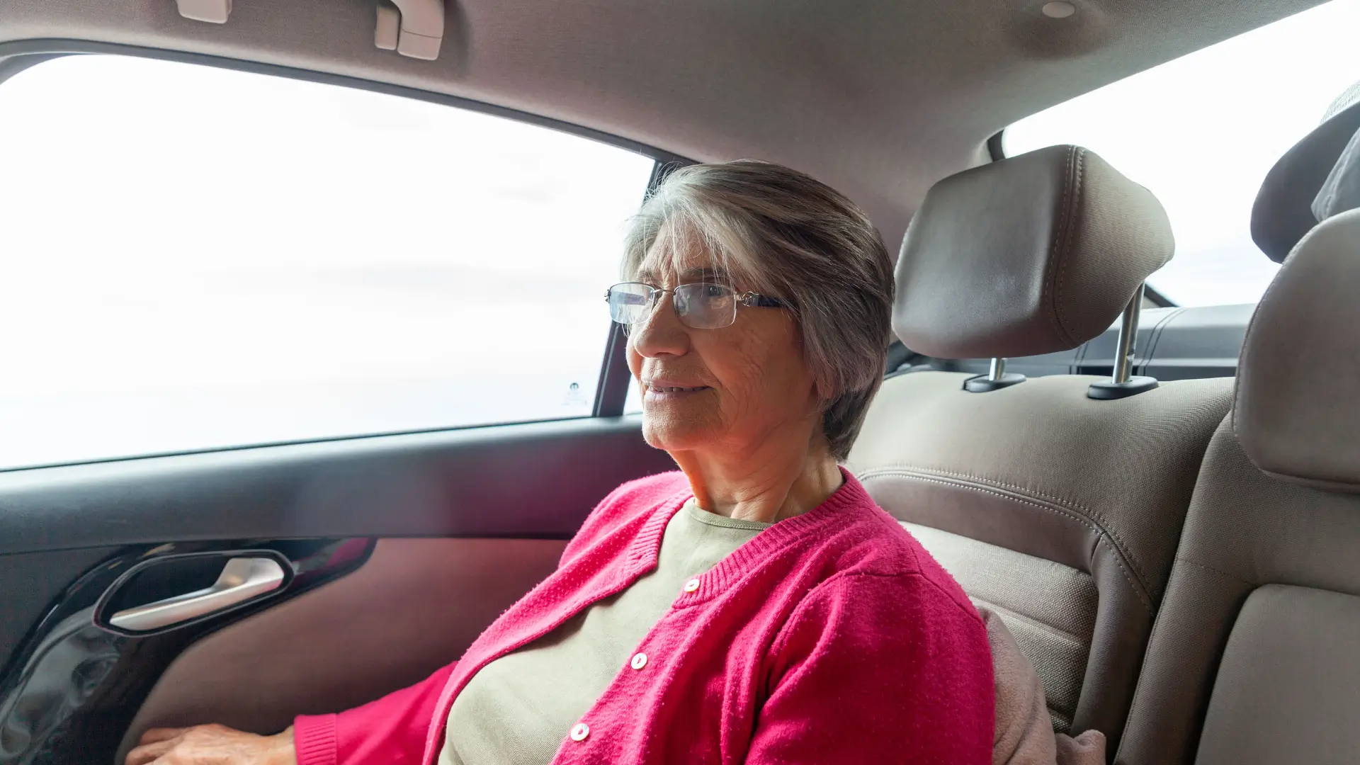 elderly woman in passenger seat